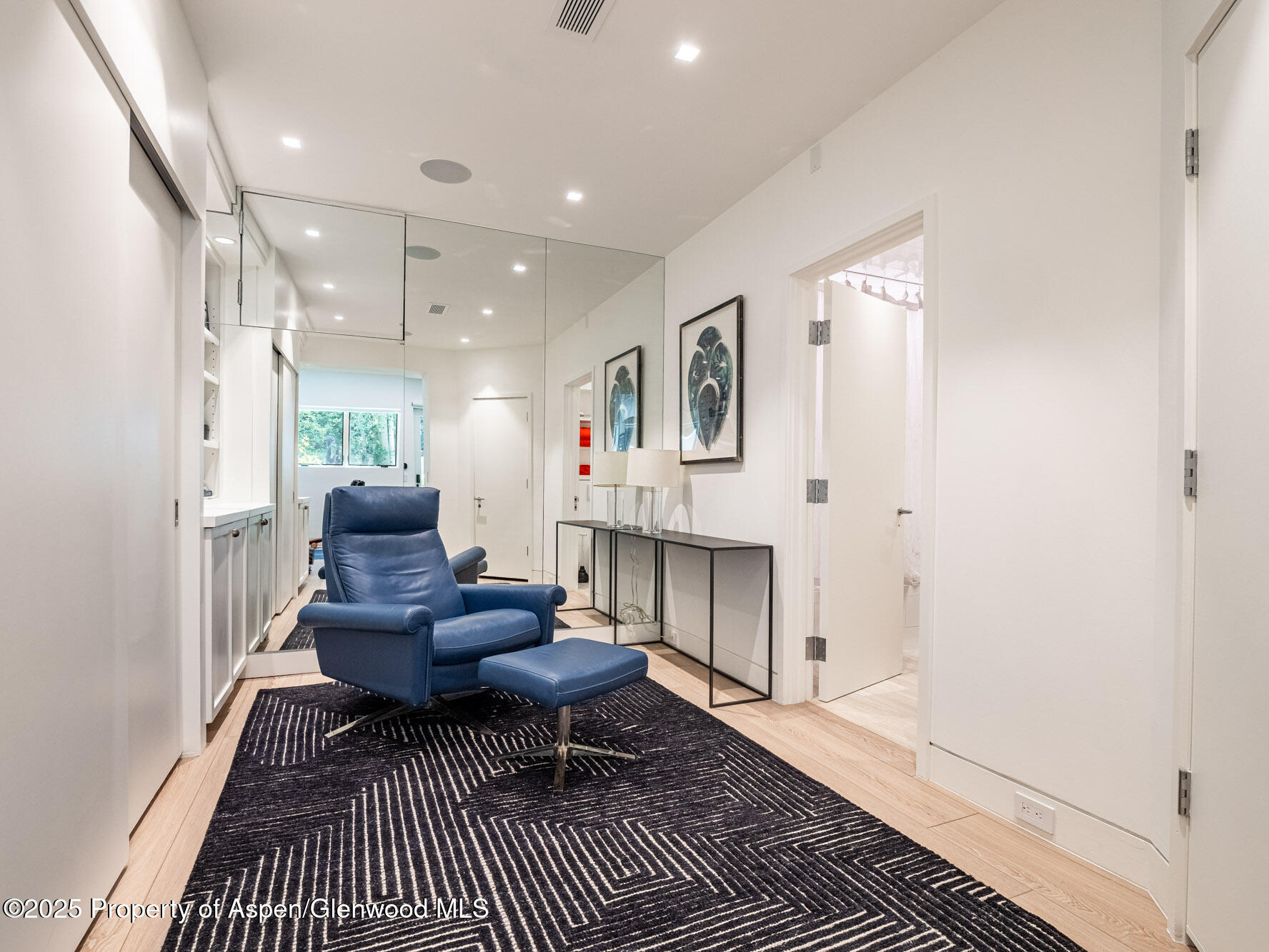 1440 Crystal Lake Road Aspen, CO 81611 - Photo 29 of 44 a living room with furniture a rug and a fireplace
