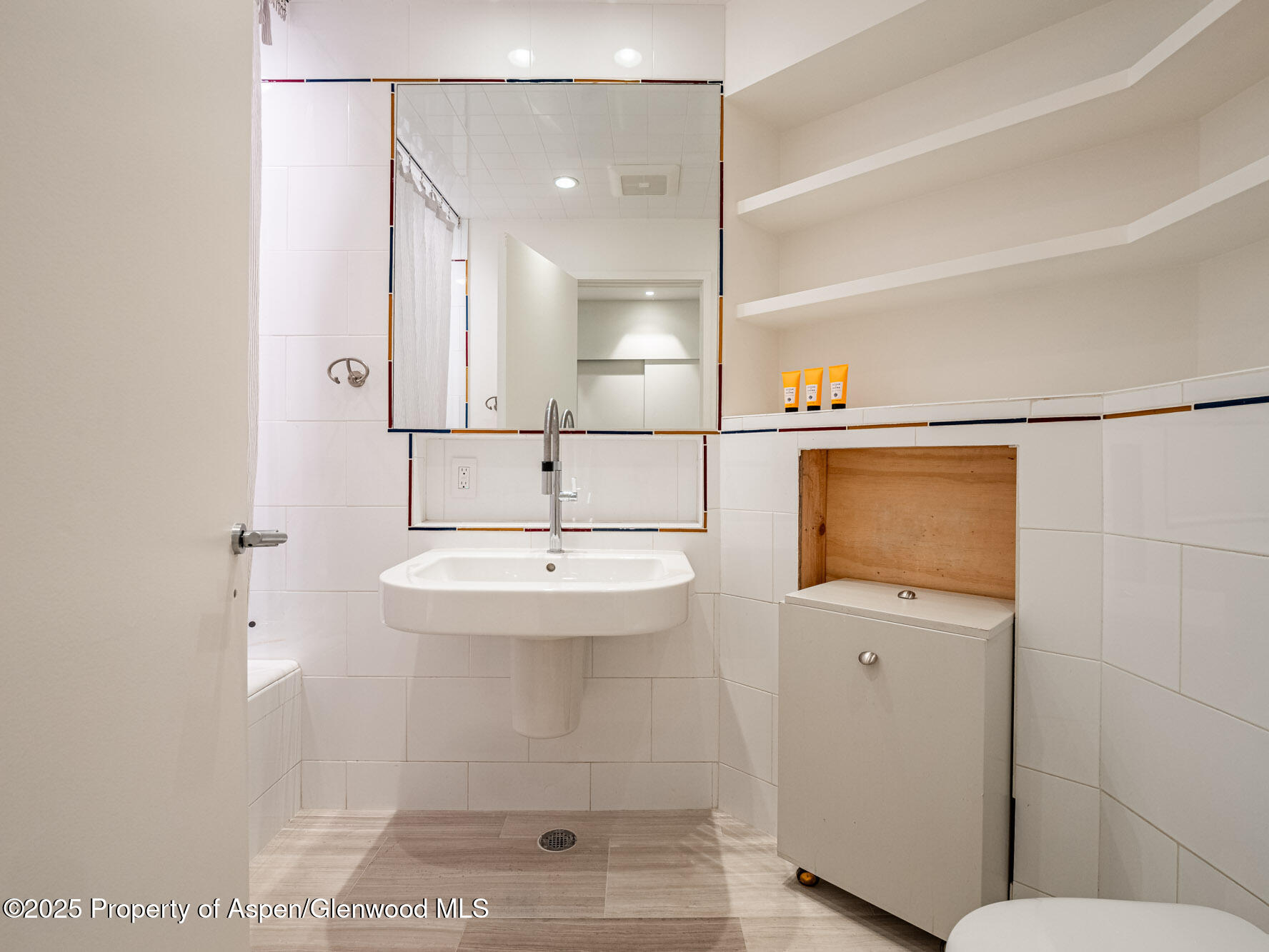 1440 Crystal Lake Road Aspen, CO 81611 - Photo 30 of 44 a bathroom with a sink a mirror and shower