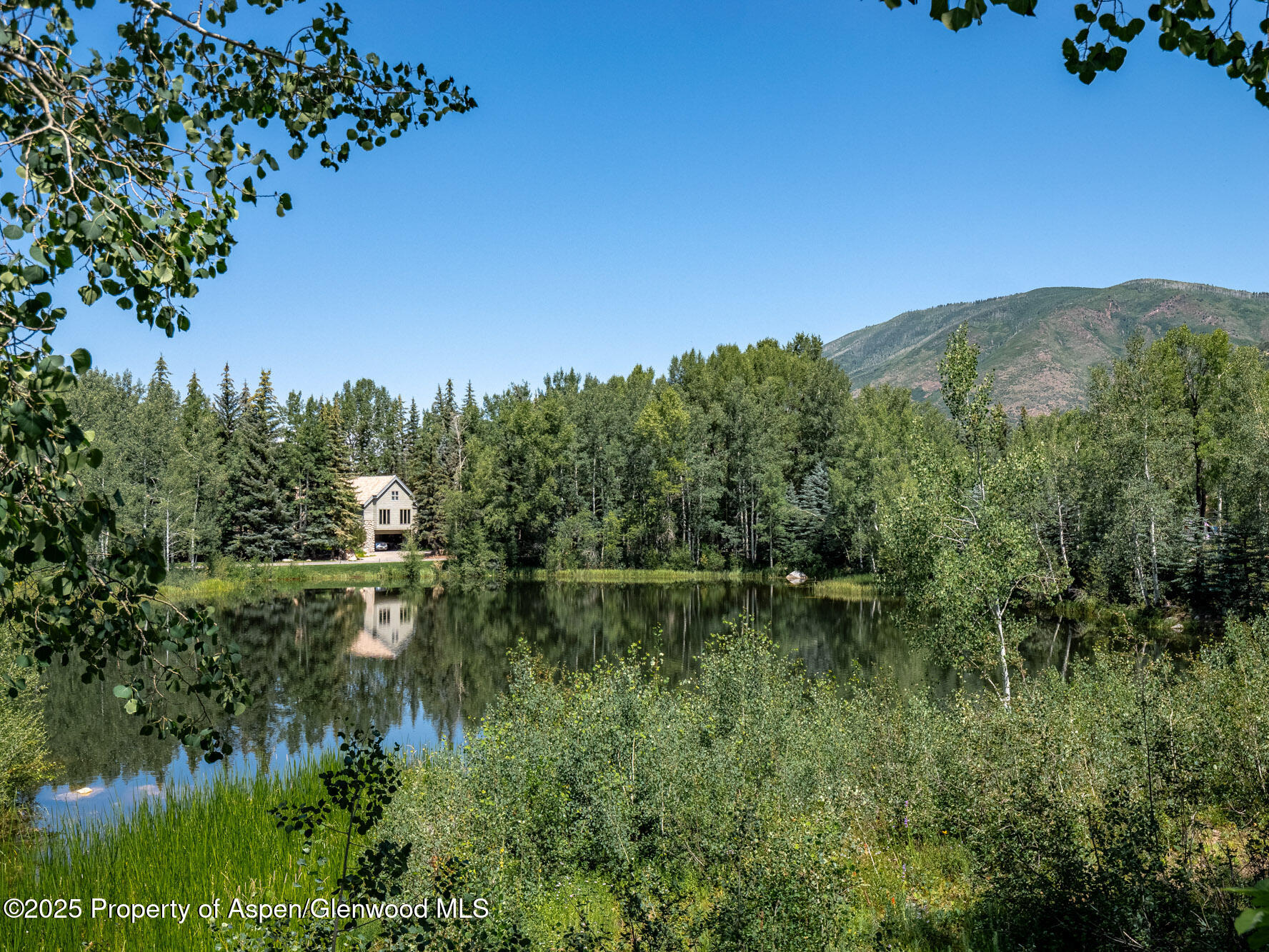 1440 Crystal Lake Road Aspen, CO 81611 - Photo 35 of 44 a view of a lake with a mountain in the background