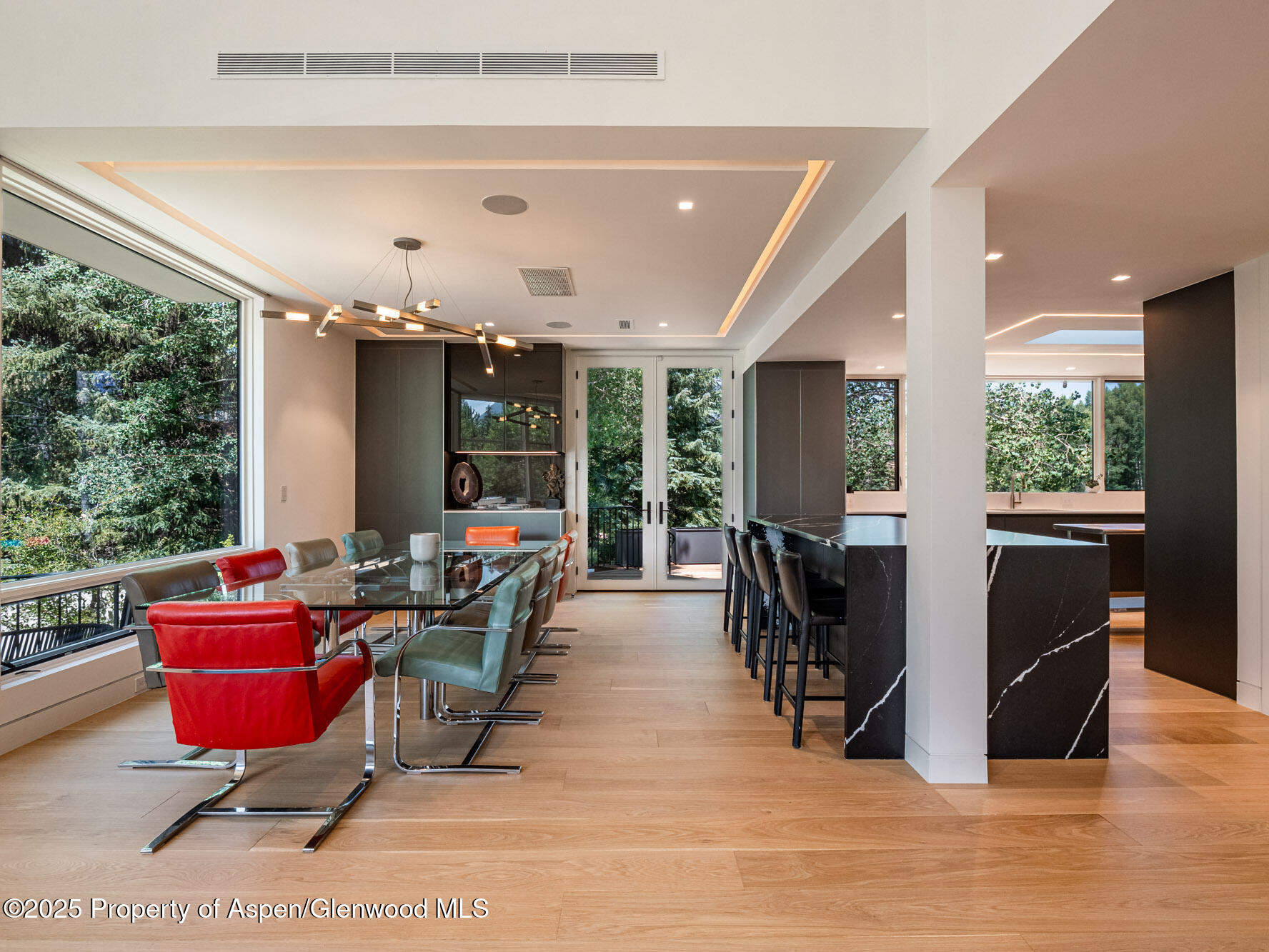 1440 Crystal Lake Road Aspen, CO 81611 - Photo 6 of 44 a living room with furniture a flat screen tv and a large window