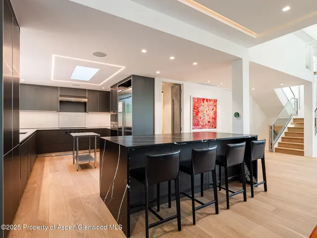 a bedroom with a bed and a flat screen television