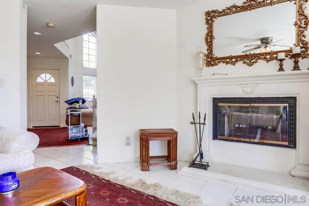 3243 San Tomas Drive Oceanside, CA 92056 - Photo 19 of 45 a living room with furniture and a fireplace