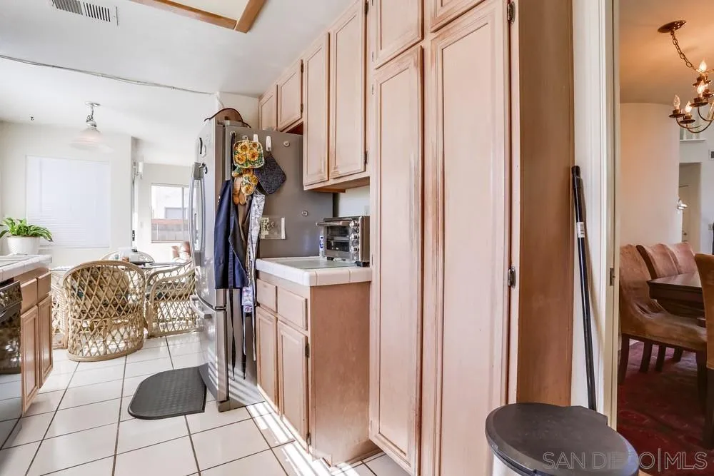 3243 San Tomas Drive Oceanside, CA 92056 - Photo 25 of 45 a living room with furniture a desk and chair with the wooden floor