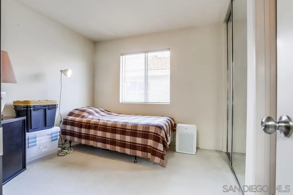 3243 San Tomas Drive Oceanside, CA 92056 - Photo 29 of 45 a bedroom with a bed and a cabinets