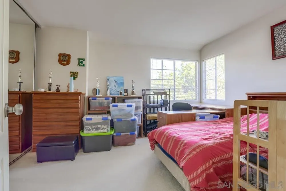 3243 San Tomas Drive Oceanside, CA 92056 - Photo 34 of 45 a bedroom with bed and windows