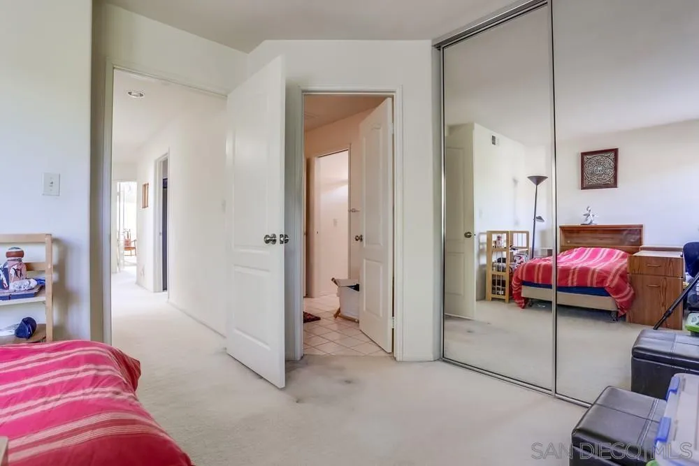 3243 San Tomas Drive Oceanside, CA 92056 - Photo 35 of 45 a bedroom with furniture and a closet