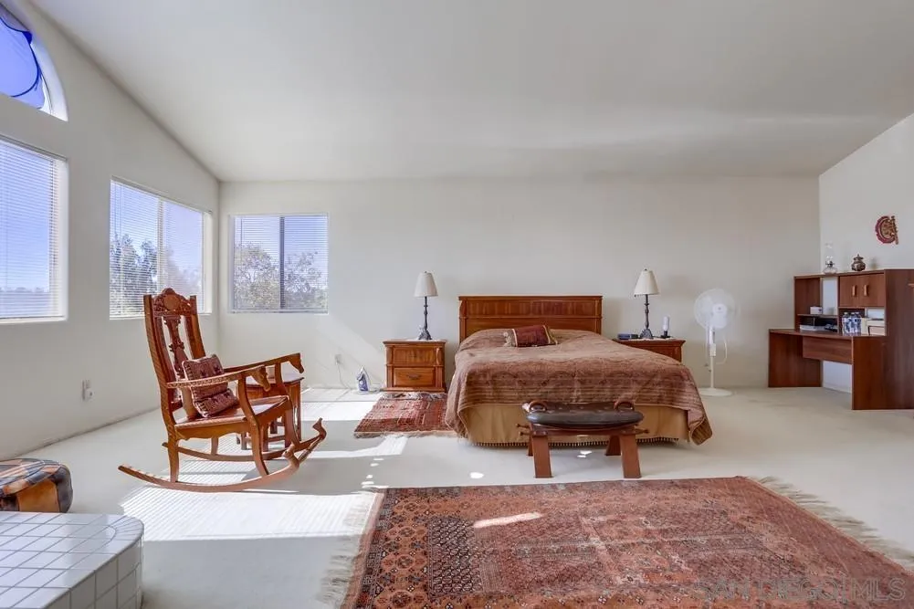 3243 San Tomas Drive Oceanside, CA 92056 - Photo 38 of 45 a bedroom with furniture and a rug