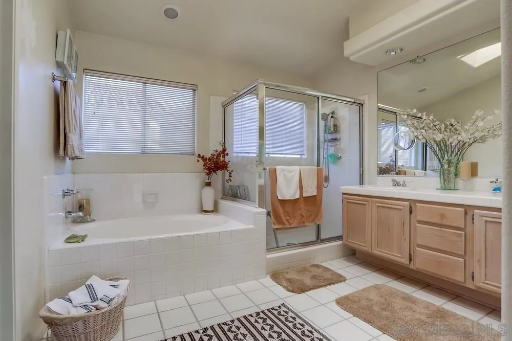 3243 San Tomas Drive Oceanside, CA 92056 - Photo 39 of 45 a bathroom with a tub sink and a mirror