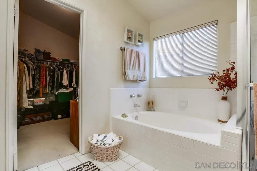 3243 San Tomas Drive Oceanside, CA 92056 - Photo 41 of 45 a bathroom with a bathtub a sink and a shower