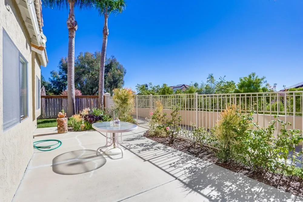 3243 San Tomas Drive Oceanside, CA 92056 - Photo 44 of 45 a view of a balcony with chair and potted plants