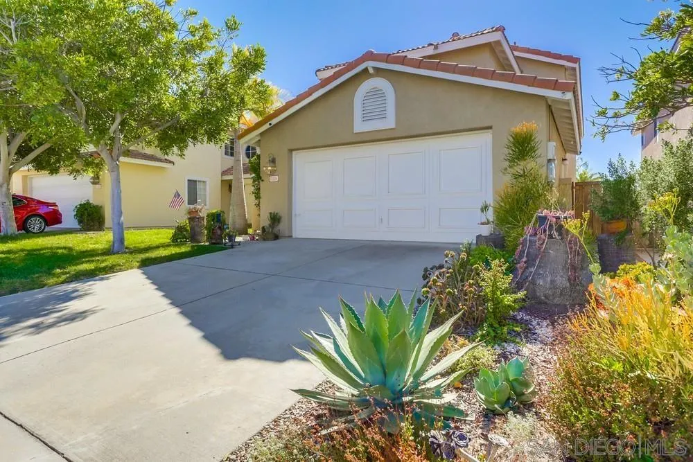 3243 San Tomas Drive Oceanside, CA 92056 - Photo 5 of 45 a front view of a house with garden