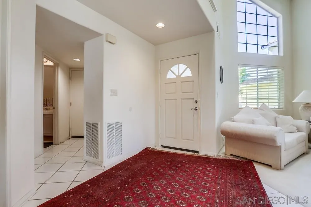 3243 San Tomas Drive Oceanside, CA 92056 - Photo 8 of 45 a view of an empty room and a bedroom