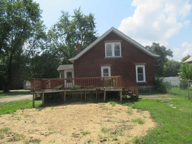 a backyard of a house with a garden
