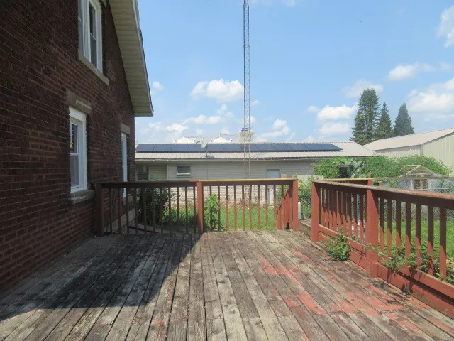 a view of a balcony with two chairs