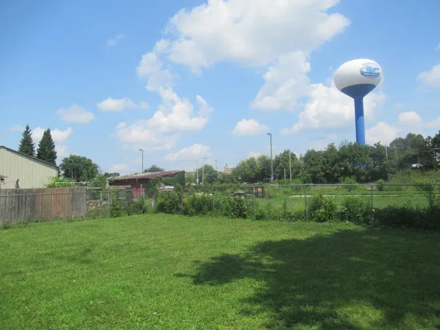 a backyard of a house with lots of green space