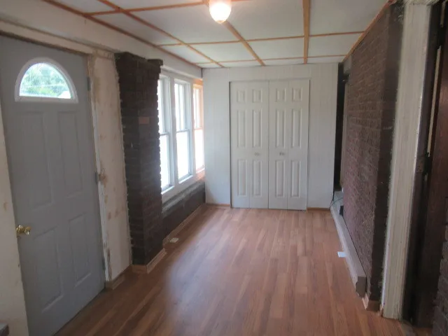 a view of entryway with wooden floor