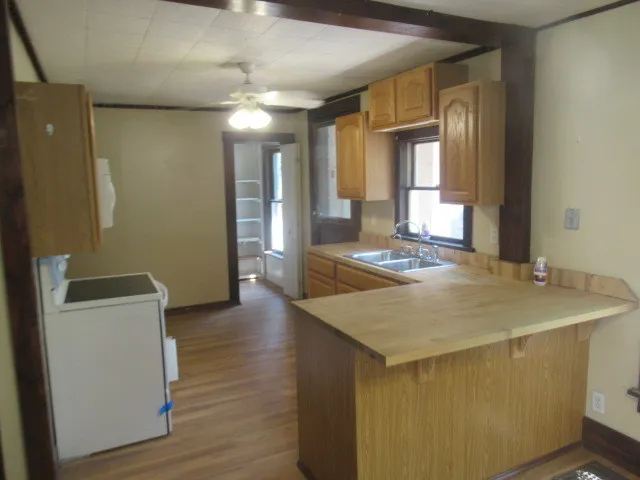 a kitchen with a sink and a refrigerator