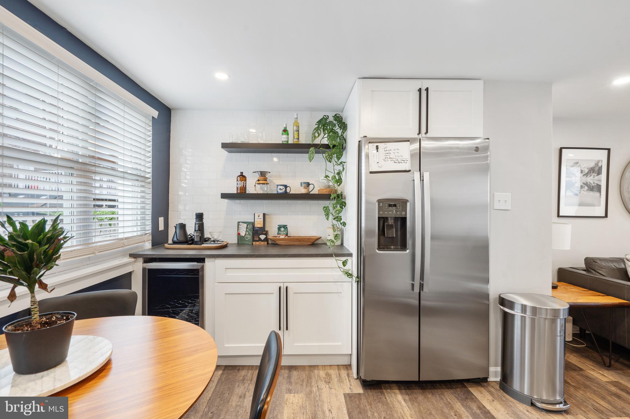 3606 Miller Street Philadelphia, PA 19134 - Photo 12 of 24 a kitchen with stainless steel appliances a refrigerator a stove a sink and white cabinets