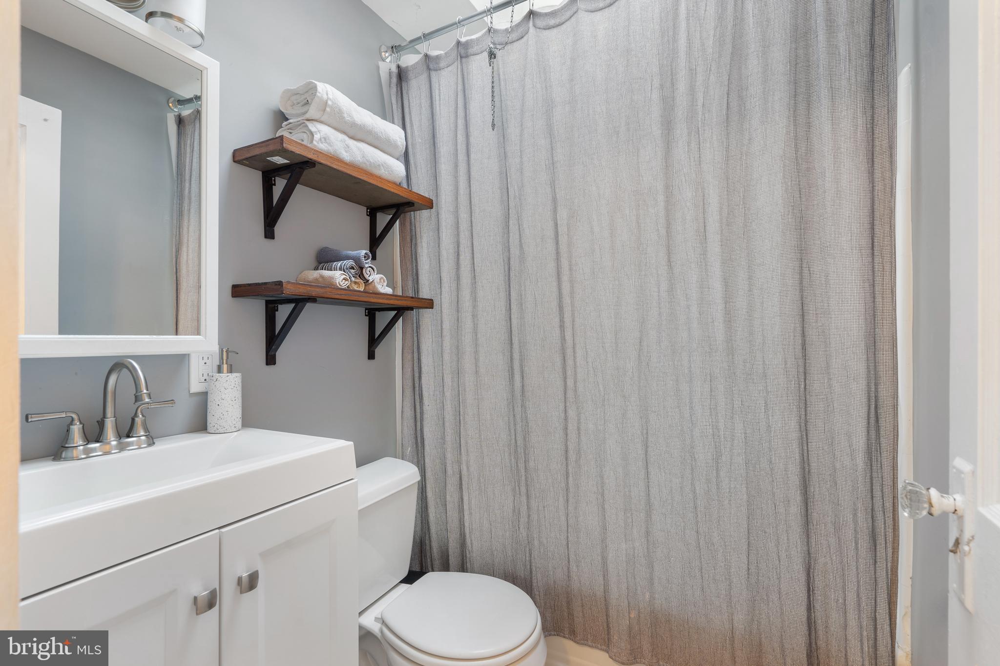 3606 Miller Street Philadelphia, PA 19134 - Photo 14 of 24 a bathroom with a sink a toilet and shower