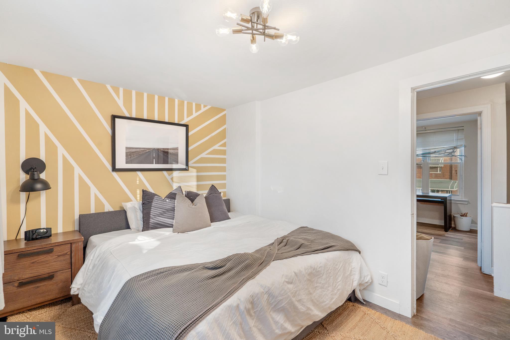 3606 Miller Street Philadelphia, PA 19134 - Photo 15 of 24 a bedroom with a bed and a large mirror