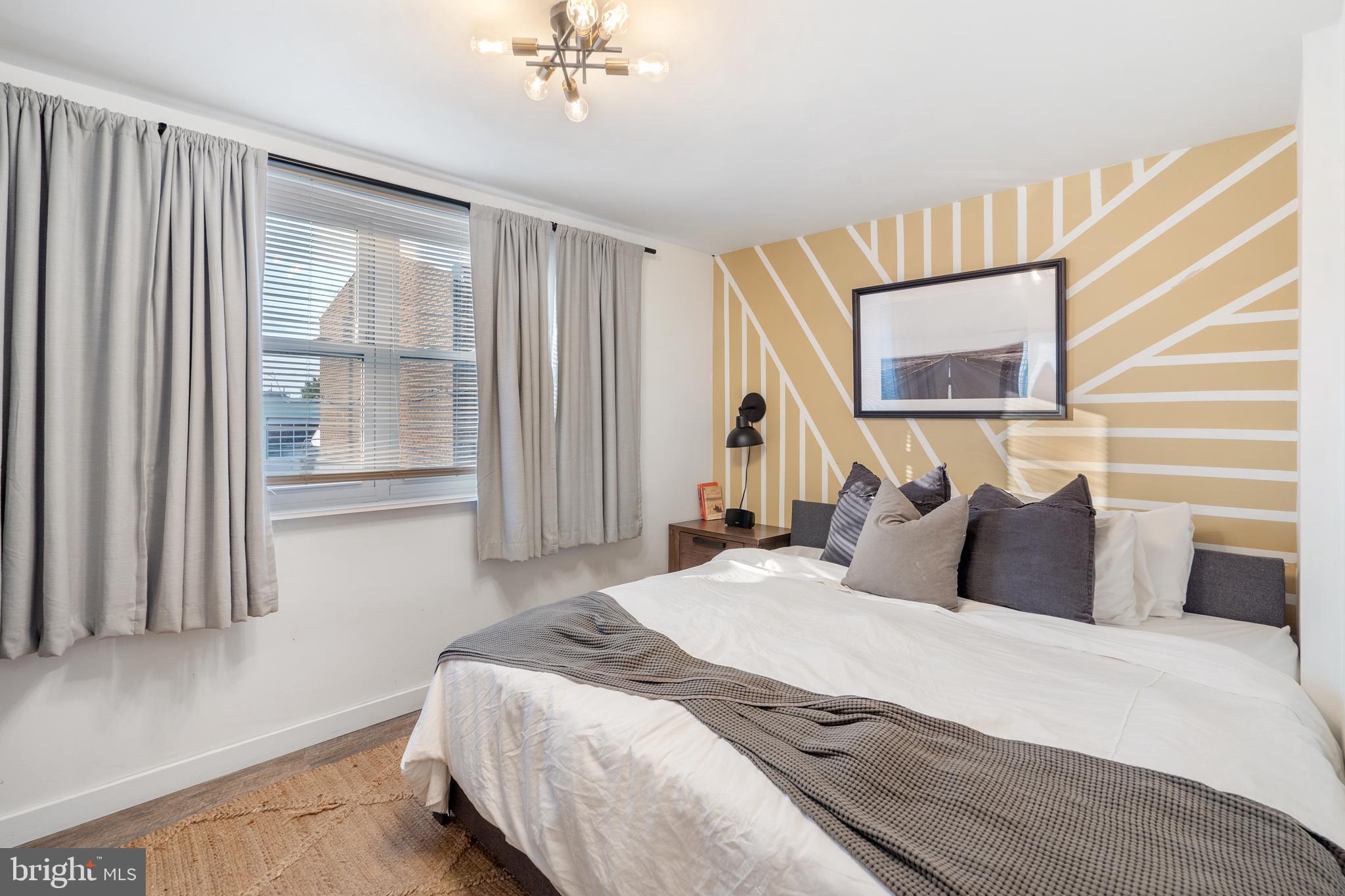 3606 Miller Street Philadelphia, PA 19134 - Photo 16 of 24 a bedroom with a large bed and a window