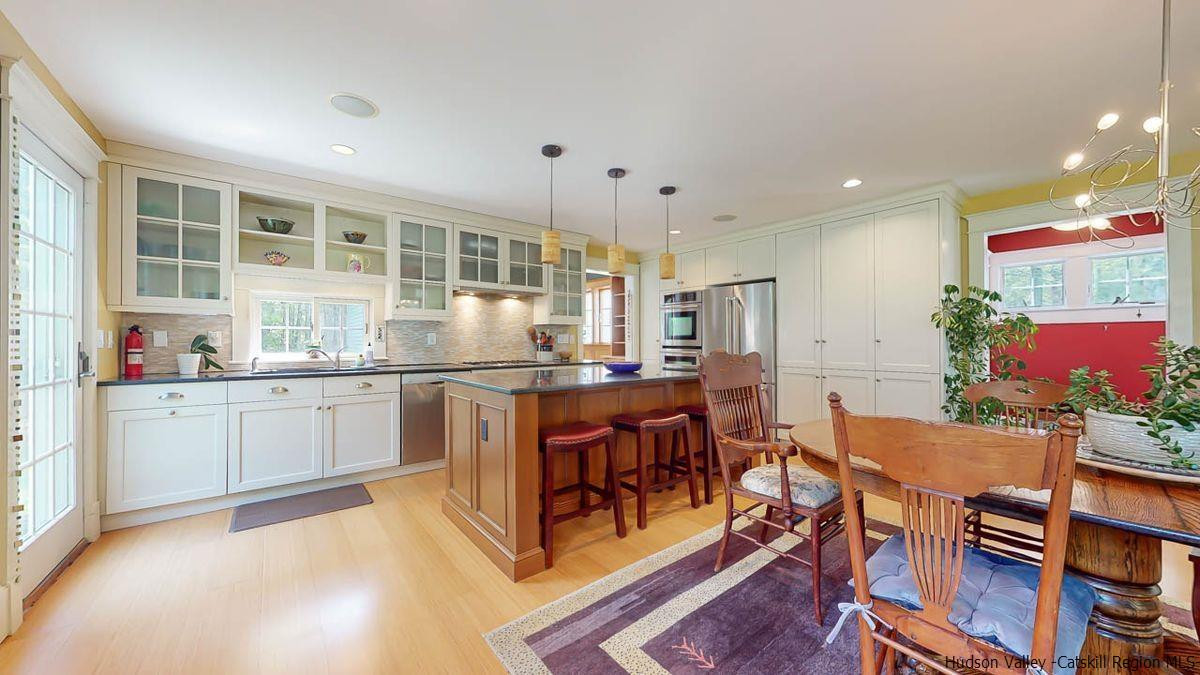 140 Scarawan Road Stone Ridge, NY 12484 - Photo 17 of 35 a kitchen with counter top space and wooden floor