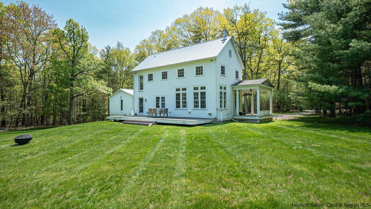 140 Scarawan Road Stone Ridge, NY 12484 - Photo 5 of 35 a front view of a house with garden
