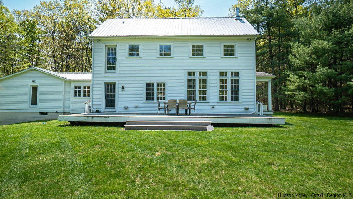140 Scarawan Road Stone Ridge, NY 12484 - Photo 8 of 35 a view of a house with a yard patio and swimming pool
