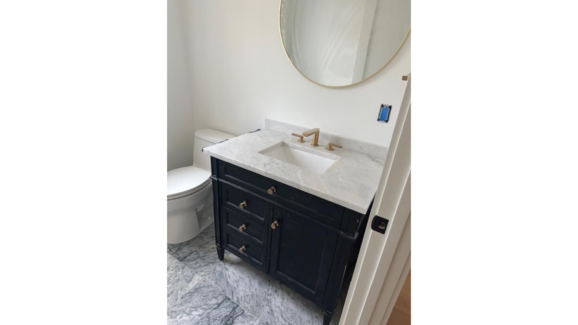 35 Mt Aldworth Road Vineyard Haven, MA 02568 - Photo 2 of 6 a bathroom with a sink and a mirror