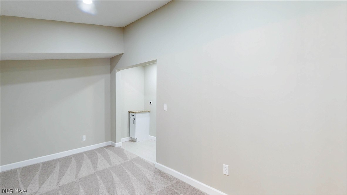 3312 Bancroft Road Akron, OH 44333 - Photo 22 of 50 Empty room with baseboards and light colored carpet