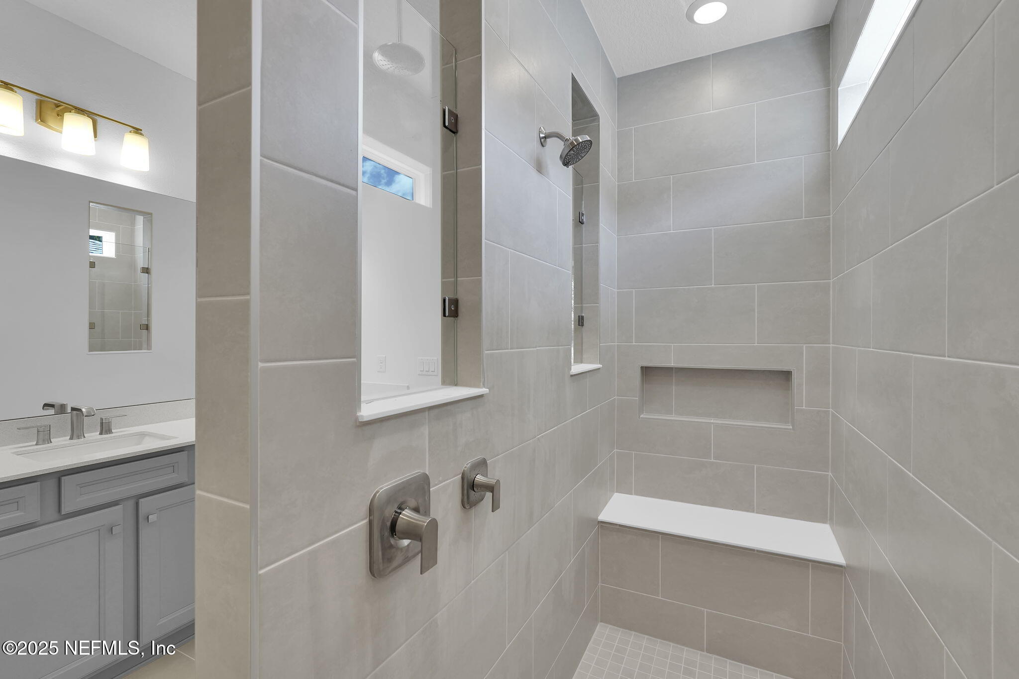 134 Headstream Drive St. Johns, FL 32259 - Photo 17 of 28 a bathroom with a tub sink and mirror