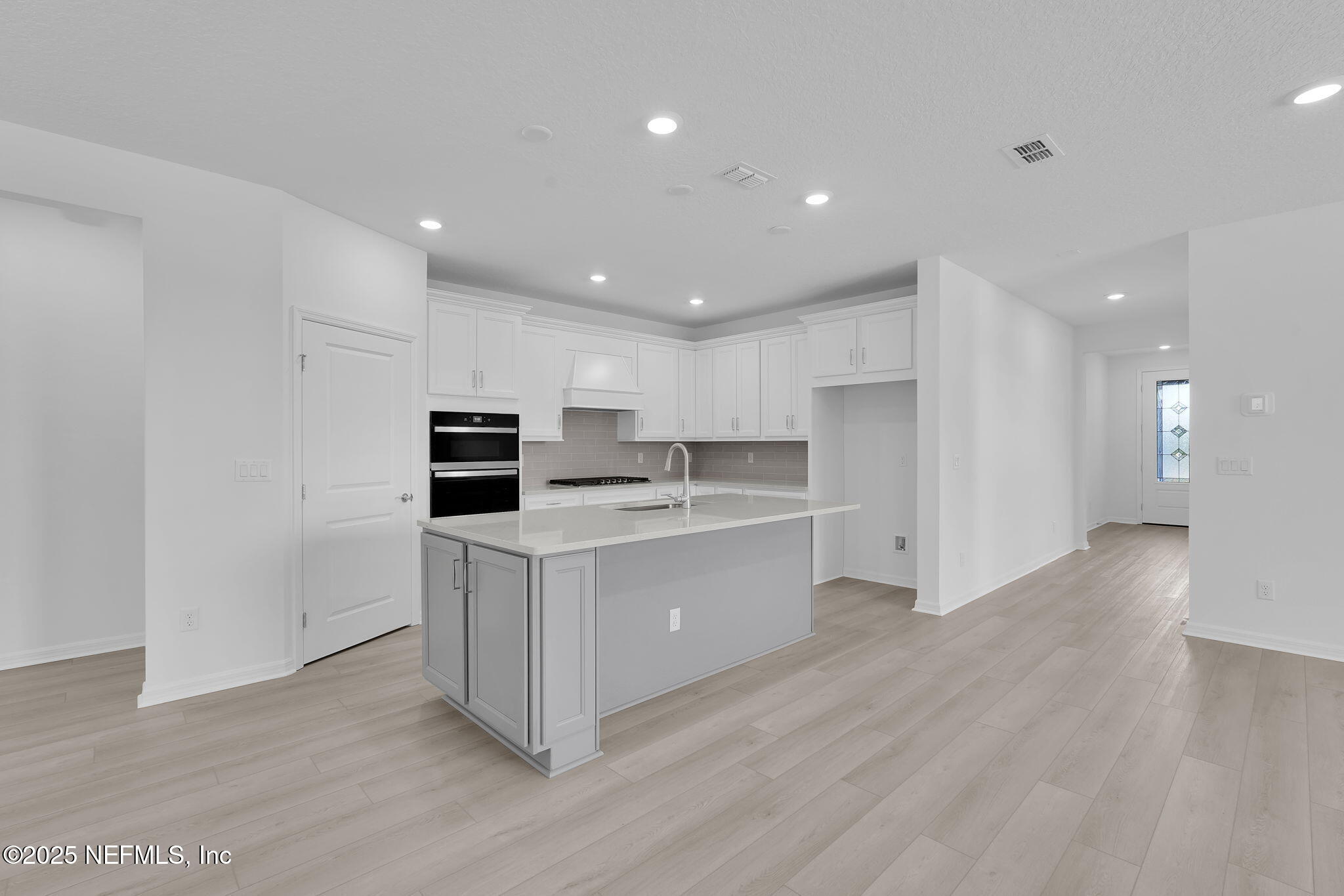 134 Headstream Drive St. Johns, FL 32259 - Photo 5 of 28 a kitchen with stainless steel appliances a refrigerator sink and cabinets