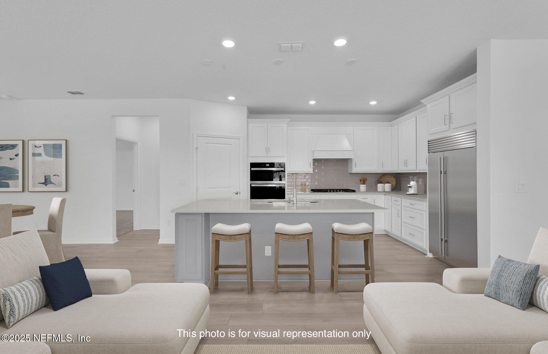 134 Headstream Drive St. Johns, FL 32259 - Photo 8 of 28 a kitchen with stainless steel appliances kitchen island granite countertop a refrigerator and microwave