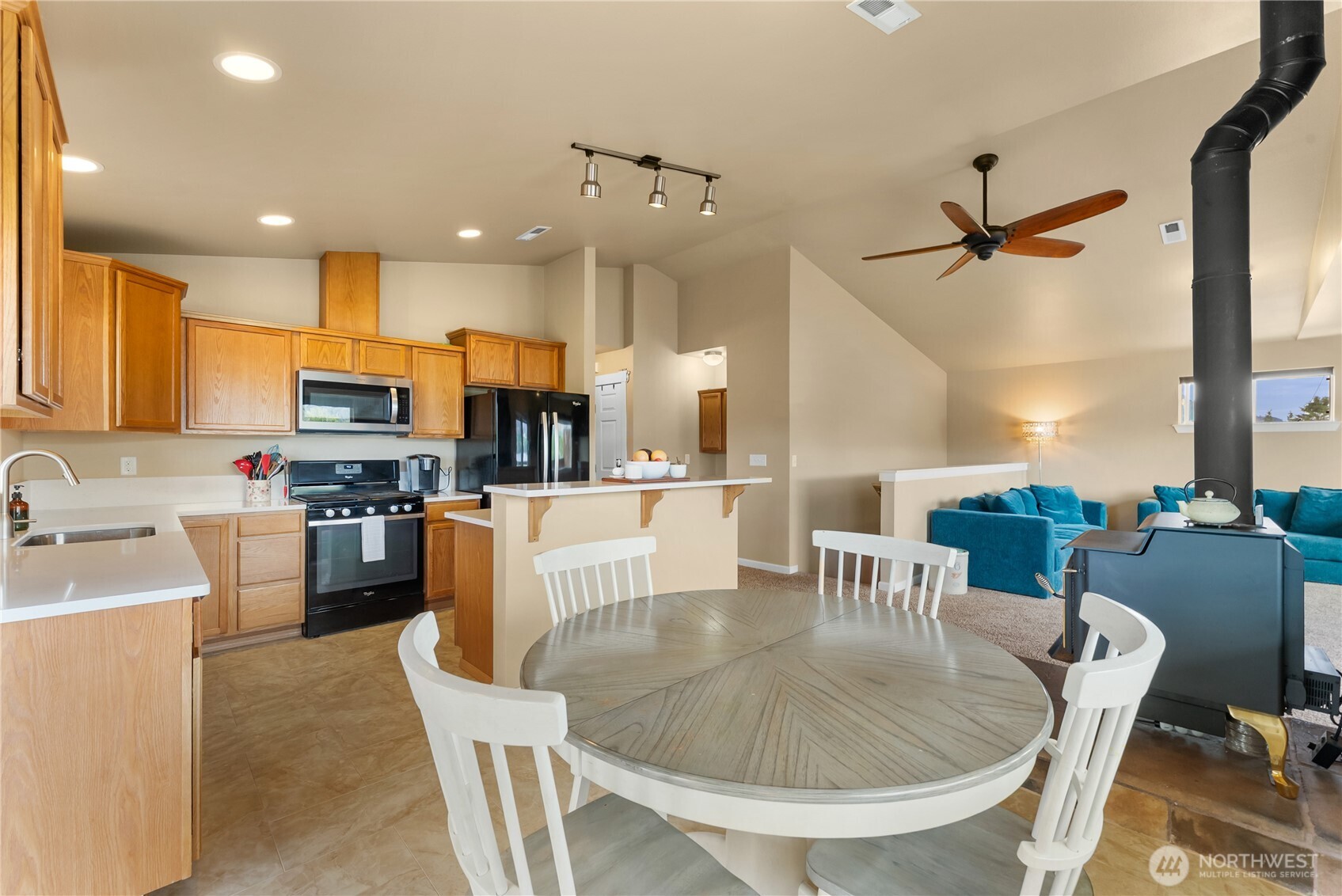 65 Eastlake Road, Unit B Oroville, WA 98844 - Photo 13 of 40 a dining room with furniture a window and kitchen view