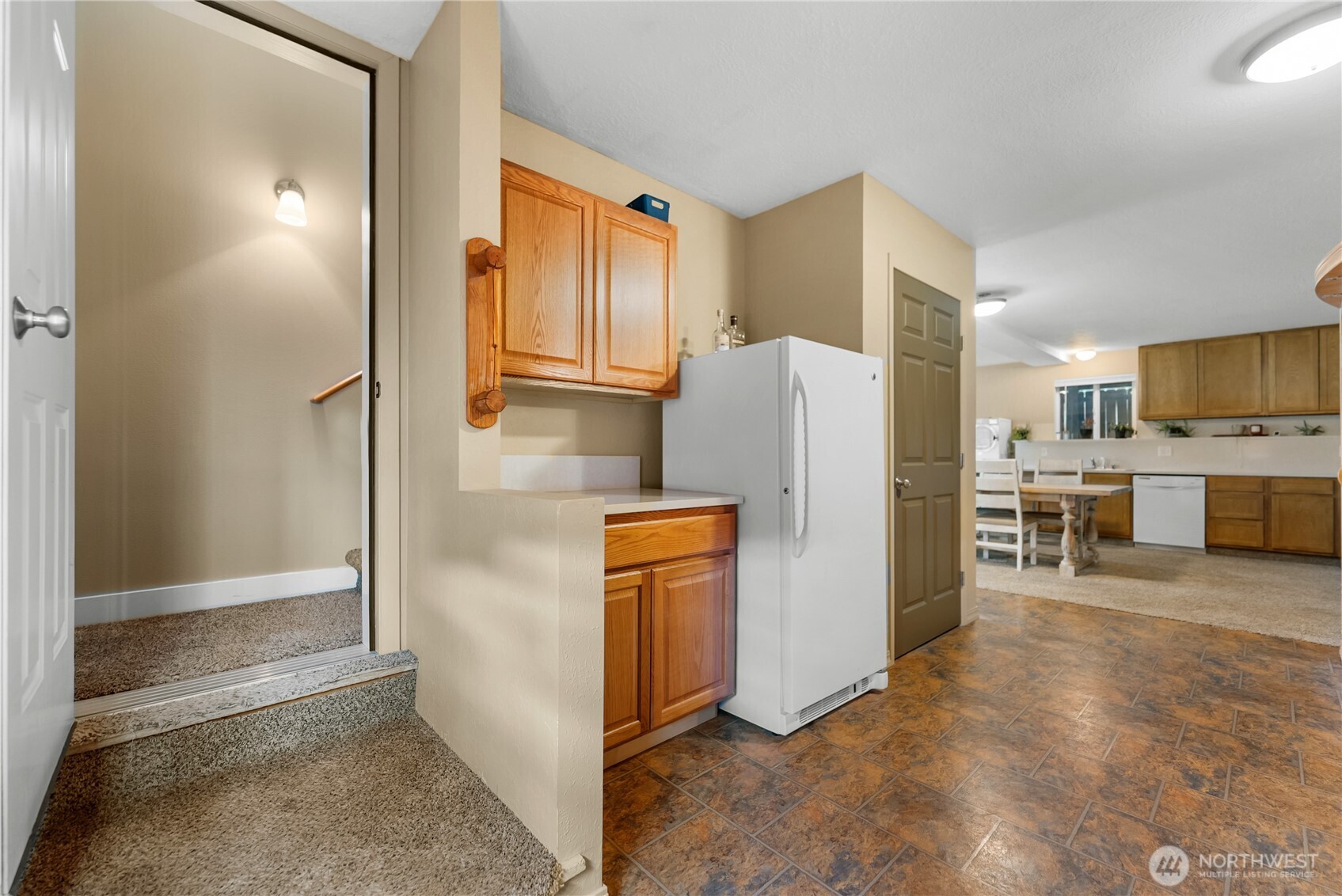65 Eastlake Road, Unit B Oroville, WA 98844 - Photo 29 of 40 a view of a kitchen with refrigerator and a stove