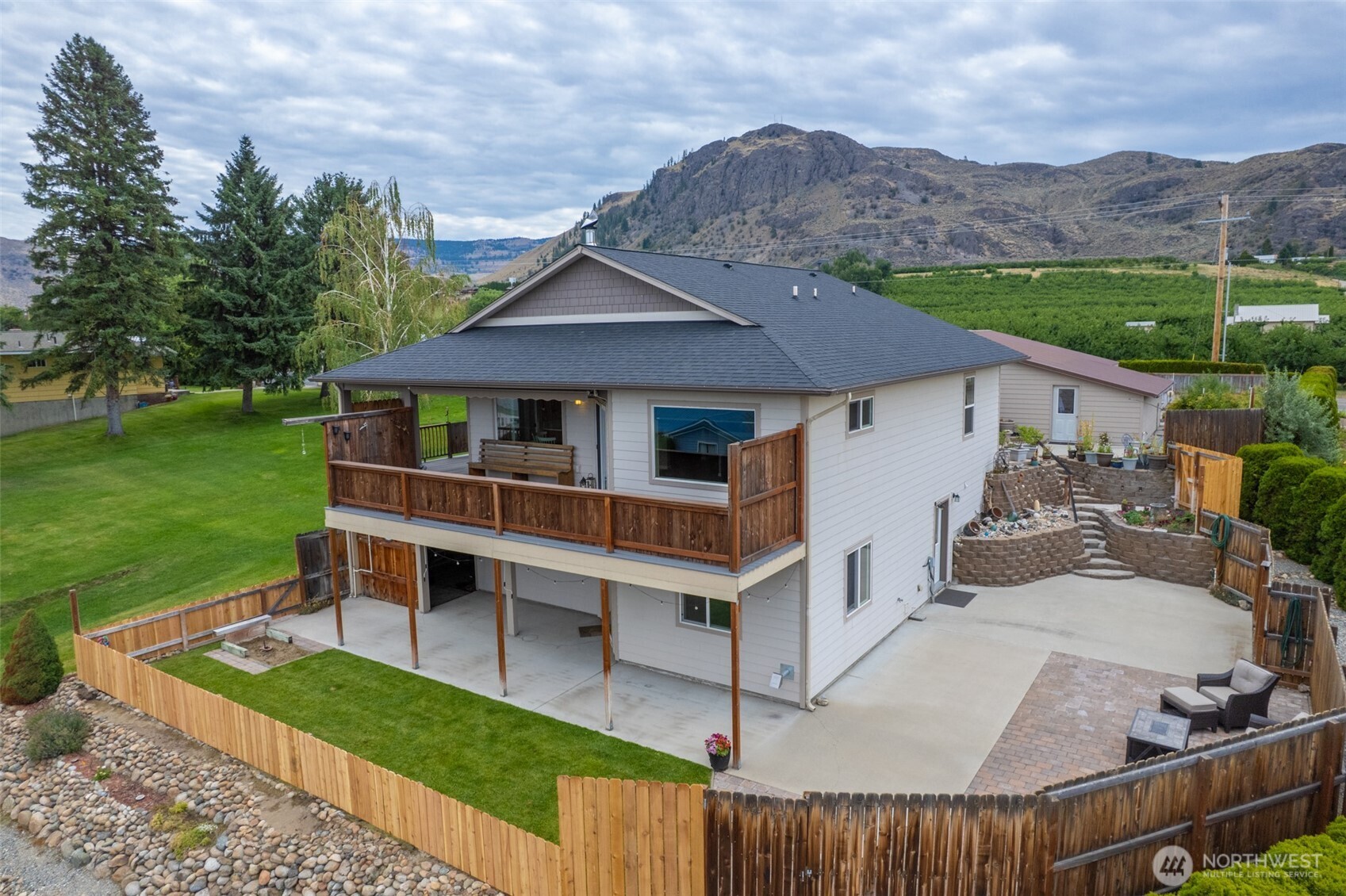 65 Eastlake Road, Unit B Oroville, WA 98844 - Photo 3 of 40 an aerial view of a house having yard patio and a garden
