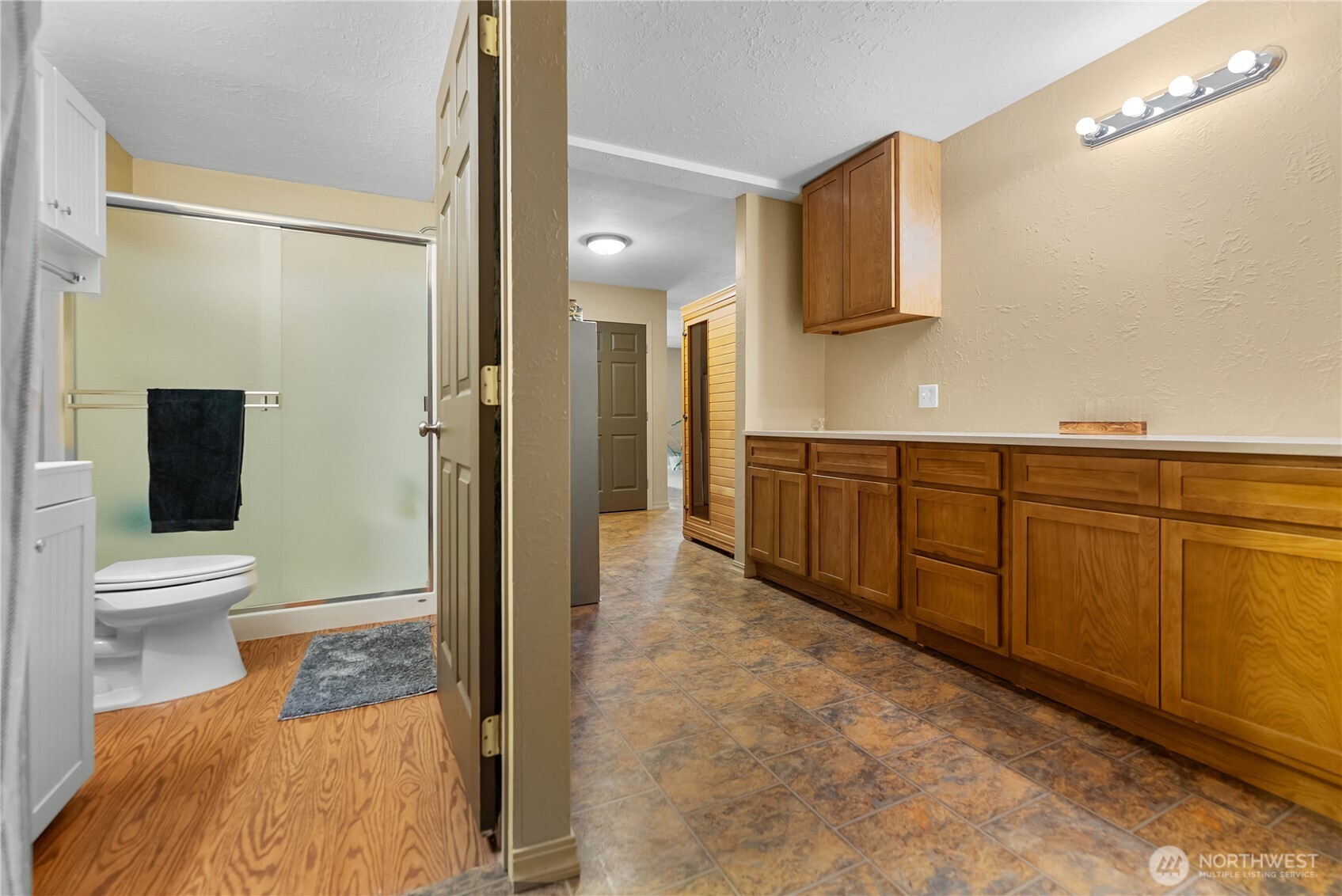 65 Eastlake Road, Unit B Oroville, WA 98844 - Photo 37 of 40 a bathroom with a toilet a sink and mirror