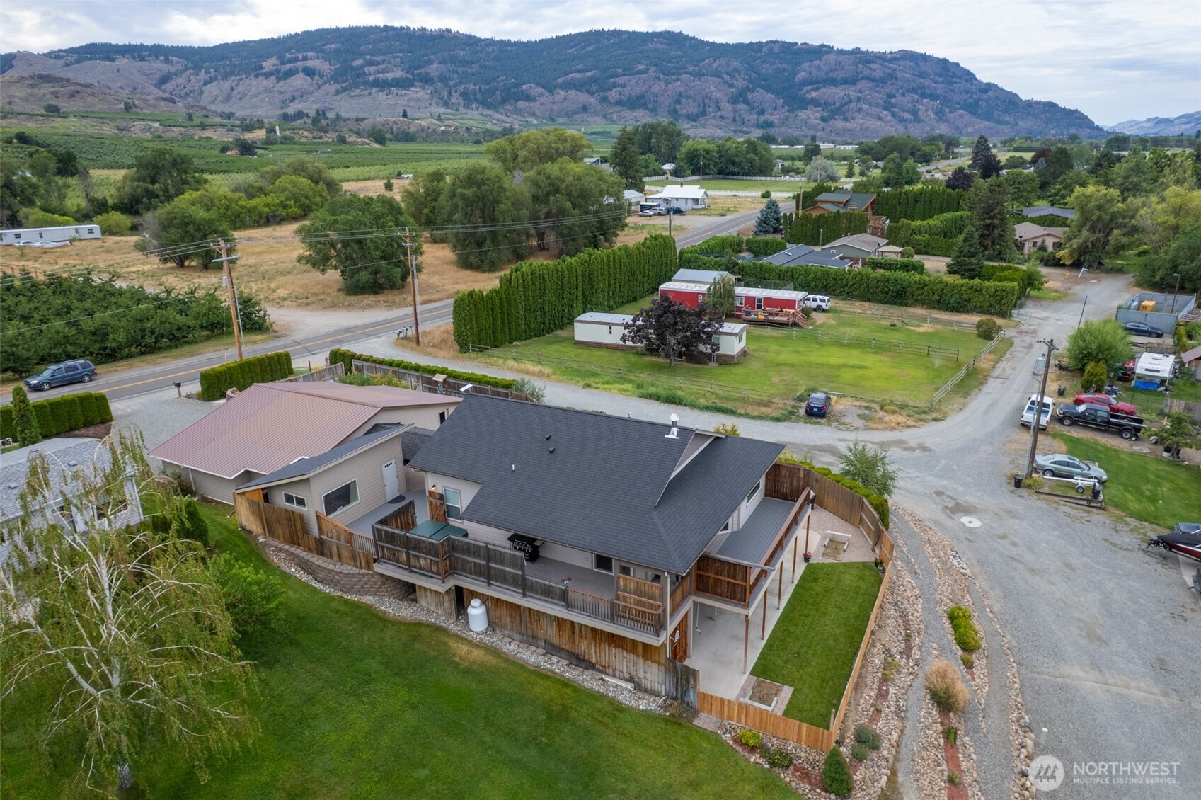 65 Eastlake Road, Unit B Oroville, WA 98844 - Photo 4 of 40 an aerial view of a house with garden