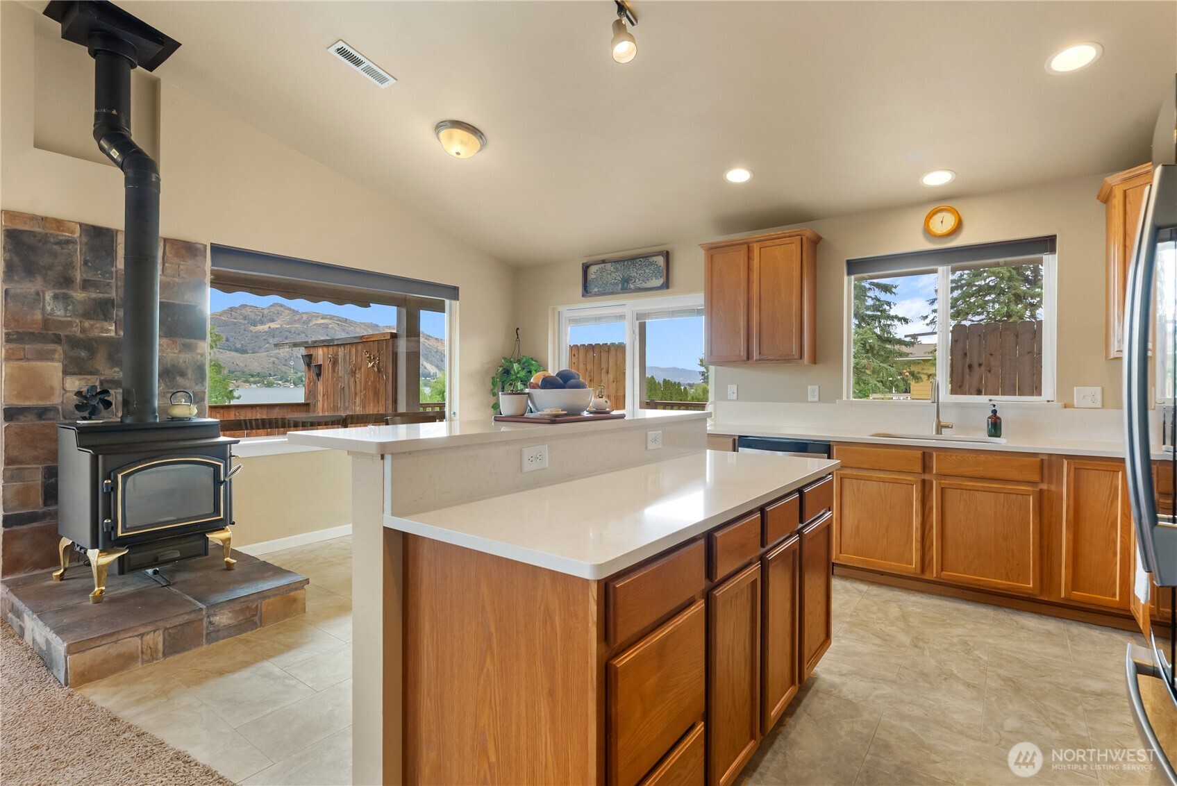 65 Eastlake Road, Unit B Oroville, WA 98844 - Photo 8 of 40 a kitchen with a sink stove and cabinets