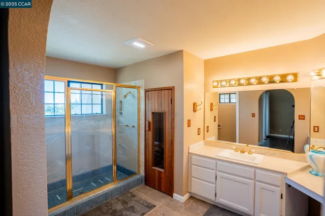 a bathroom with a double vanity sink and mirror