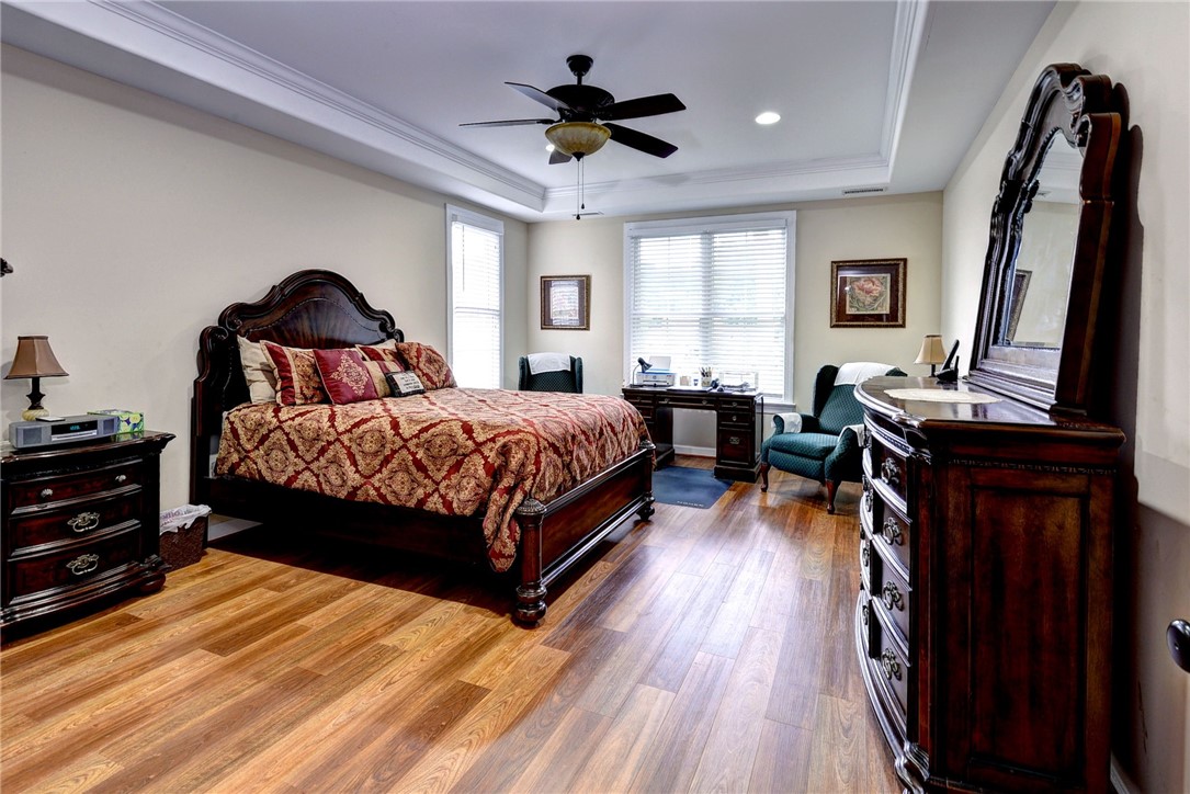 11 Butler Farm Road Hampton, VA 23666 - Photo 25 of 39 Bedroom featuring light wood-style flooring, ornamental molding, a raised ceiling, recessed lighting, and ceiling fan