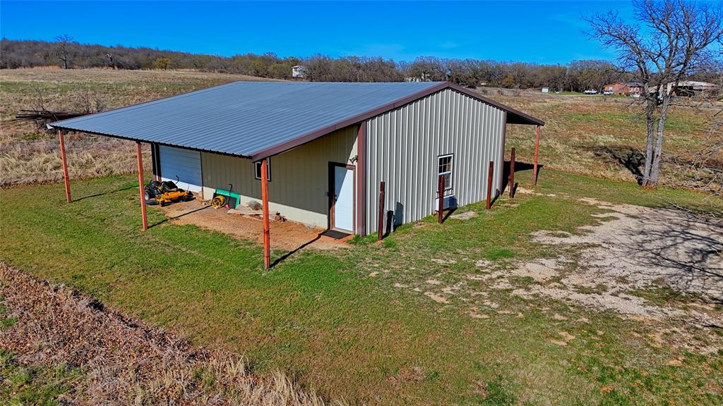 4460 Hildreth Pool Road Bowie, TX 76230 - Photo 30 of 40 a view of a house with a yard