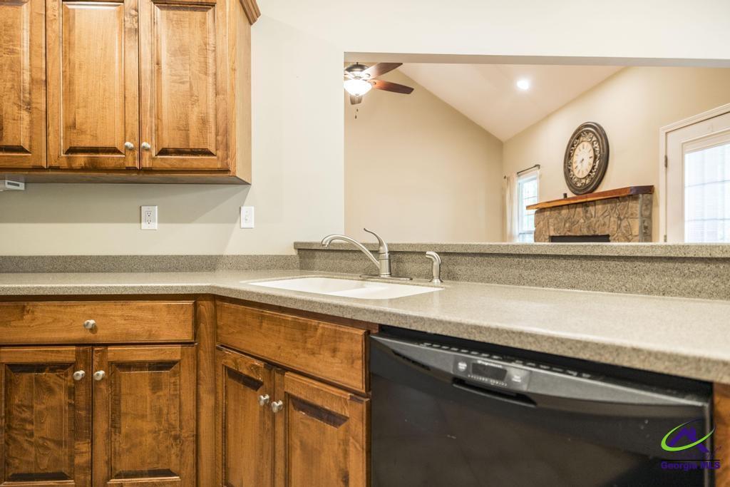 204 Smith Road Haddock, GA 31033 - Photo 15 of 51 a kitchen with a sink and a mirror
