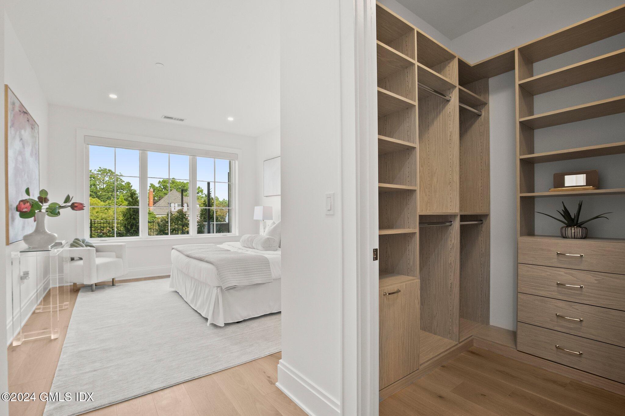 71 Havemeyer Place, Unit 303S Greenwich, CT 06830 - Photo 18 of 26 a living room with furniture and a large window