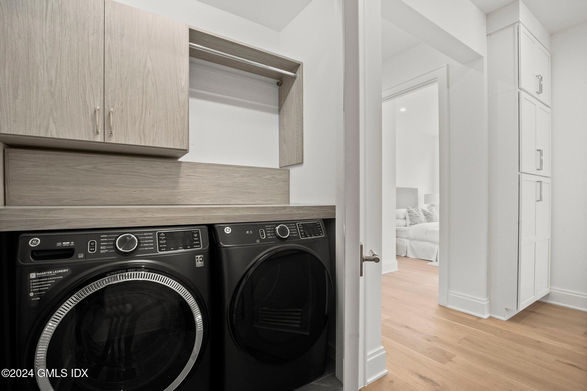 71 Havemeyer Place, Unit 303S Greenwich, CT 06830 - Photo 23 of 26 a view of washer and dryer in a utility room