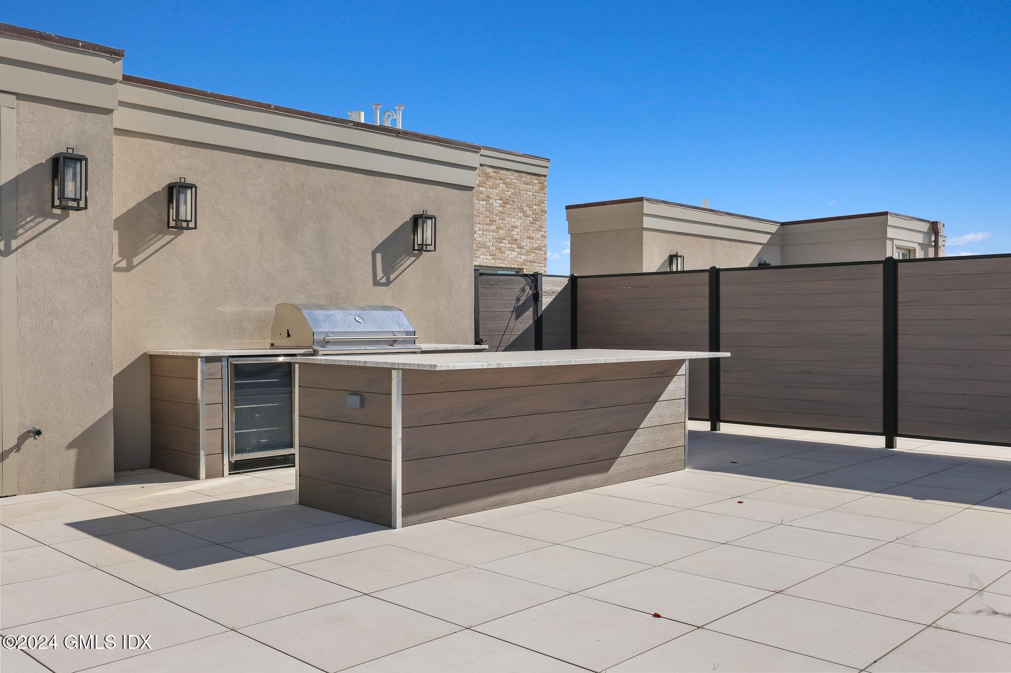 71 Havemeyer Place, Unit 303S Greenwich, CT 06830 - Photo 24 of 26 a view of outdoor space and barbecue grill