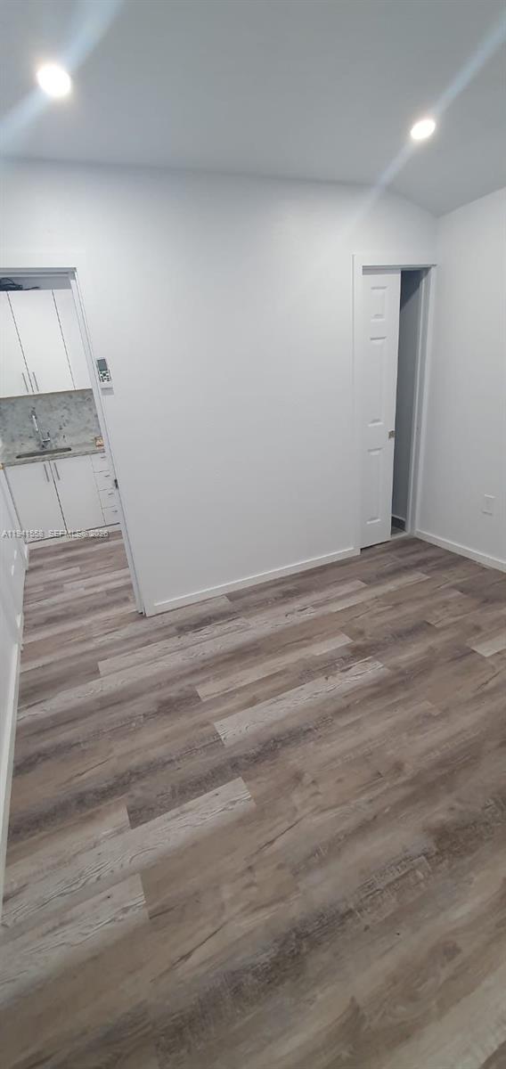 21600 Southwest 260th Street Homestead, FL 33031 - Photo 12 of 23 a view of a room with wooden floor and cabinet