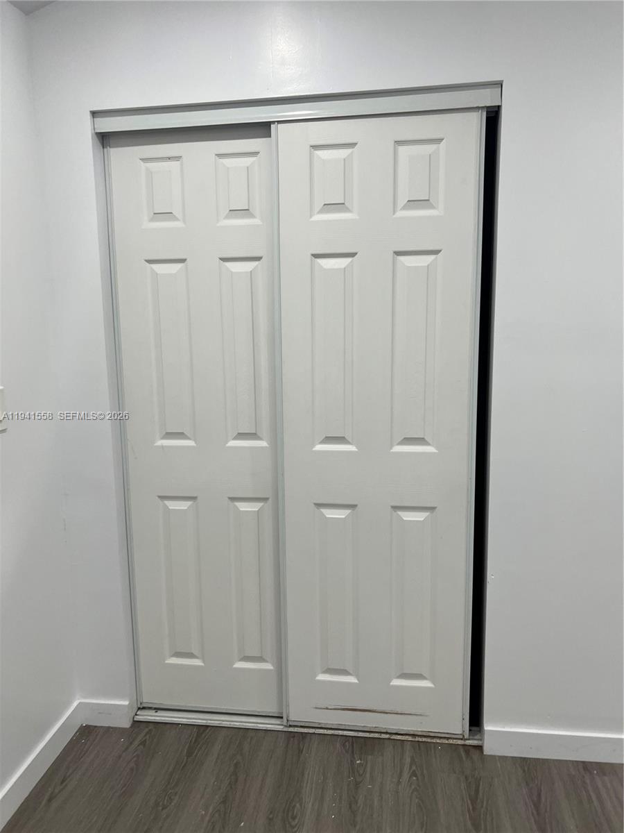 21600 Southwest 260th Street Homestead, FL 33031 - Photo 13 of 23 an empty room with cabinet door