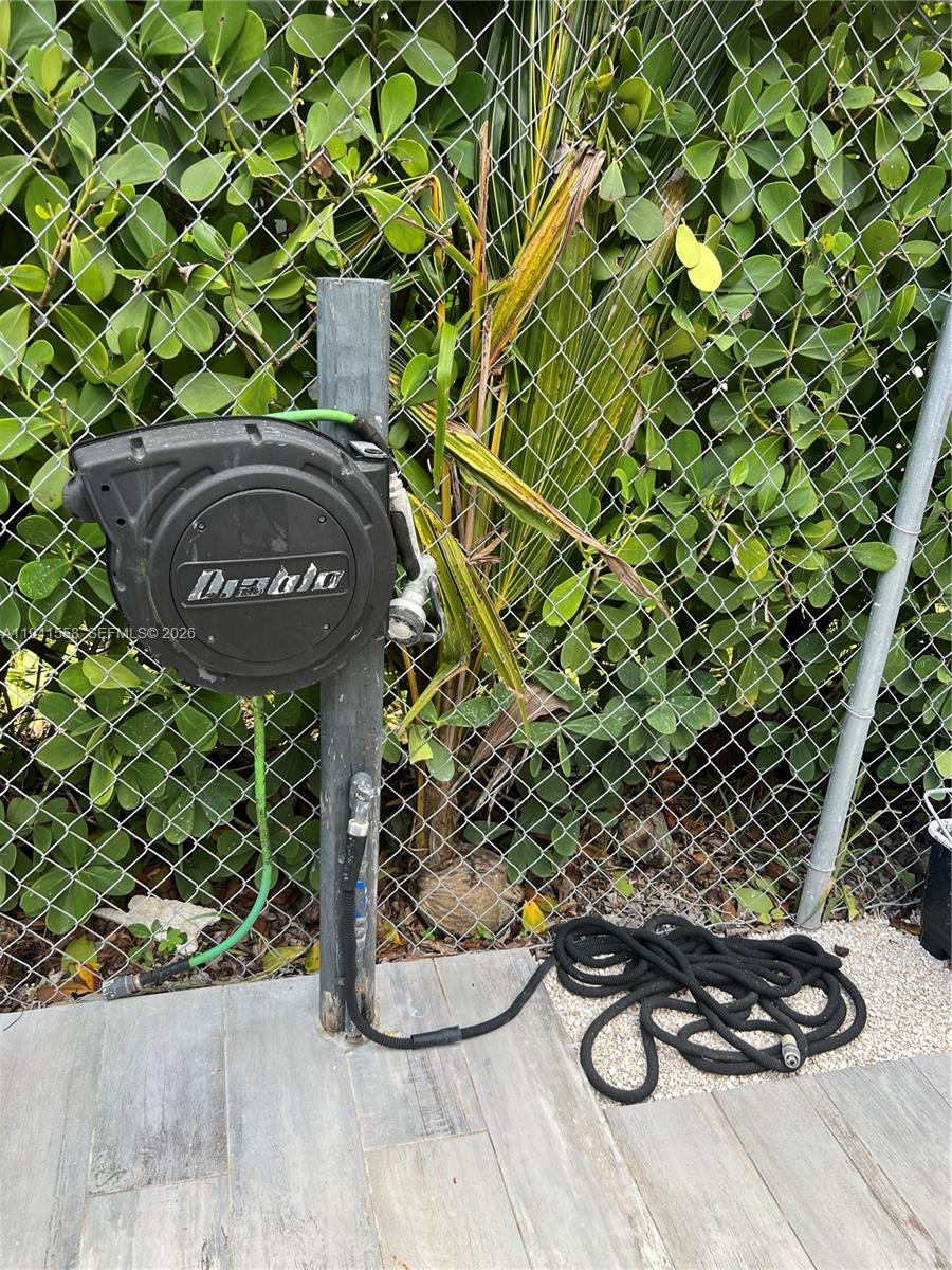 21600 Southwest 260th Street Homestead, FL 33031 - Photo 18 of 23 a view of a backyard with table and chairs