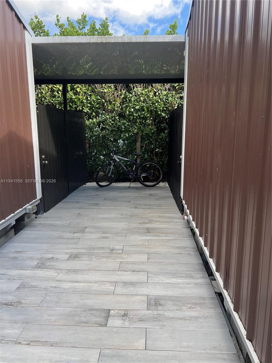 21600 Southwest 260th Street Homestead, FL 33031 - Photo 19 of 23 a view of outdoor space with wooden fence